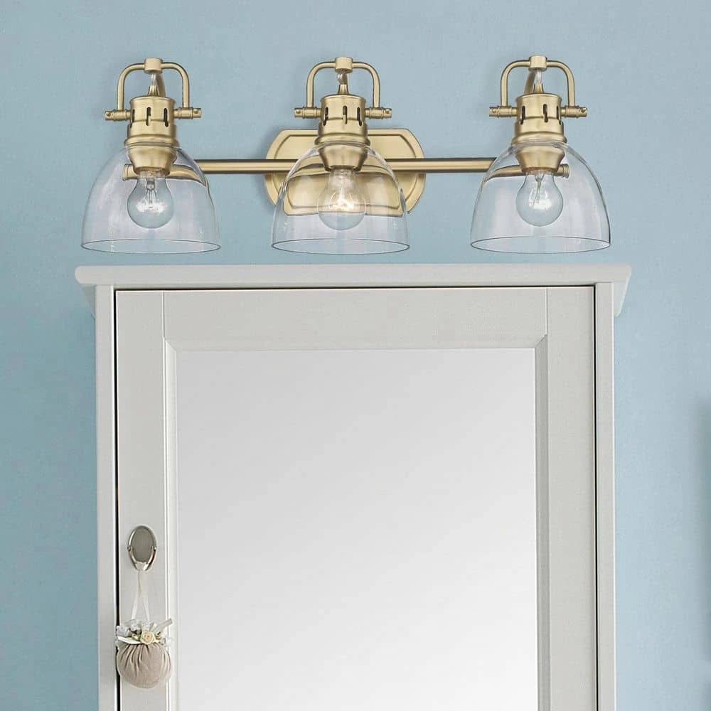 Duncan 24.5 in. 3-Light Brushed Champagne Bronze Vanity Light with Clear Glass Shades by Golden Lighting 7 Duncan 24.5 in. 3-Light Brushed Champagne Bronze Vanity Light with Clear Glass Shades by Golden Lighting - Image 5